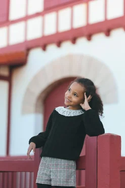 Pull Noir col volanté